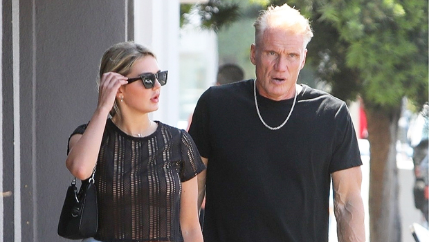Dolph Lundgren, 63, & Fiance Emma Krokdal, 24, Rock Matching Outfits & Hold Hands In New Pics