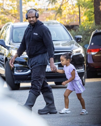 Los Angeles, CA  - *EXCLUSIVE* - Kanye West is out in dad mode as we spot the rapper/designer at his daughter North's basketball game in Los Angeles. Kanye holds Chicago by the hand as he walks alongside a nanny during North's game.Pictured: Kanye WestBACKGRID USA 29 JULY 2022 USA: +1 310 798 9111 / usasales@backgrid.comUK: +44 208 344 2007 / uksales@backgrid.com*UK Clients - Pictures Containing ChildrenPlease Pixelate Face Prior To Publication*