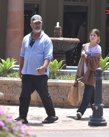 Malibu, CA  - *EXCLUSIVE*  - Actor Mel Gibson seen in a baseball cap a long sleeve shirt and sandals enjoying a sunny day in Malibu with his daughter.  Pictured: Mel Gibson  BACKGRID USA 8 JUNE 2022   USA: +1 310 798 9111 / usasales@backgrid.com  UK: +44 208 344 2007 / uksales@backgrid.com  *UK Clients - Pictures Containing Children Please Pixelate Face Prior To Publication*