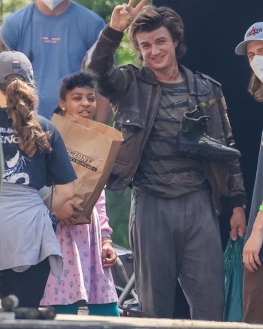 Atlanta, GA  - *EXCLUSIVE*  - The Cast of 'Stranger Things' prepares for War as the main cast plus 3 new members get into character to film the next season while on location, in Atlanta and from the look of it, things are about to get real! A shirtless Joe Kerry was seen bruised as they prepared to film a battle scene with Natalia Dyer holding a shotgun. Sadie Sink, Maya Hawk and new cast members are scene in these new images! *Shot on June 14, 2021*

Pictured: Joe Keery

BACKGRID USA 15 JUNE 2021 

USA: +1 310 798 9111 / usasales@backgrid.com

UK: +44 208 344 2007 / uksales@backgrid.com

*UK Clients - Pictures Containing Children
Please Pixelate Face Prior To Publication*