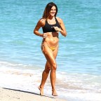 Kelly Bensimon is spotted jogging on the beach in Miami