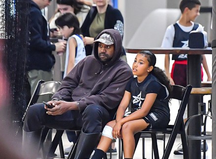 Kanye West and Daughter North West were spotted courtside at his basketball game in Thousand Oaks, CA.  The Two Seem Bonding Amidst His Game Breakdown.  21 Oct 2022 Photo: Kanye West & Daughter North West Seen Courtside At His Basketball Game In Thousand Oaks, CA.  The Two Seem Bonding Amidst His Game Breakdown.  Photo credit: @CelebCandidly / MEGA TheMegaAgency.com +1 888 505 6342 (Mega Agency TagID: MEGA910307_001.jpg) [Photo via Mega Agency]