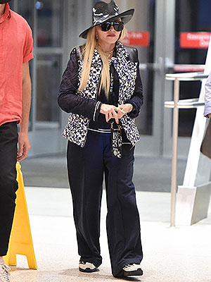Madonna Rocks Louis Vuitton Vest & Fedora At JFK Airport – Hollywood Life