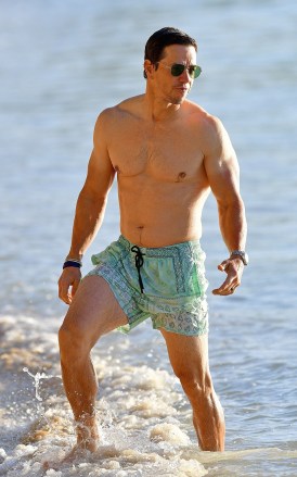 Bridgetown, BARBADOS - *EXCLUSIVE* - Actor Mark Wahlberg shows off his impressive physique out in the glorious sunshine on Sandy Lane Hotel's beach in Barbados on Wednesday.  Mark was out enjoying some time on the beach and stopped to chat with a nearby fan who gifted him the cap off his head, Mark happily took it and was seen wearing it happily.  Pictured: Mark Wahlberg BACKGRID USA 22 DECEMBER 2022 BYLINE MUST READ: @246PapsTEAM / BACKGRID USA: +1 310 798 9111 / usasales@backgrid.com UK: +44 208 344 2007 / uksales@backgrid.com *UK Clients - Pictures Containing Children Please Pixelate Face Prior To Publication*