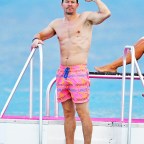 *EXCLUSIVE* Mark Wahlberg's beach figure steals the spotlight while on a family holiday in Barbados.