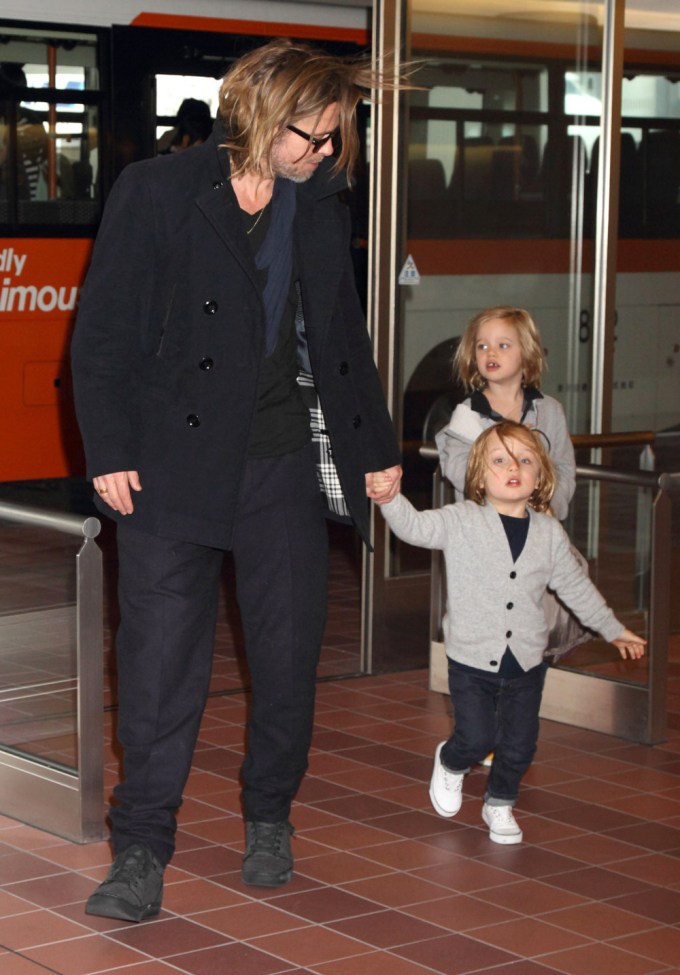 Shiloh Jolie-Pitt With Dad Brad & Brother Knox At An Airport In Japan