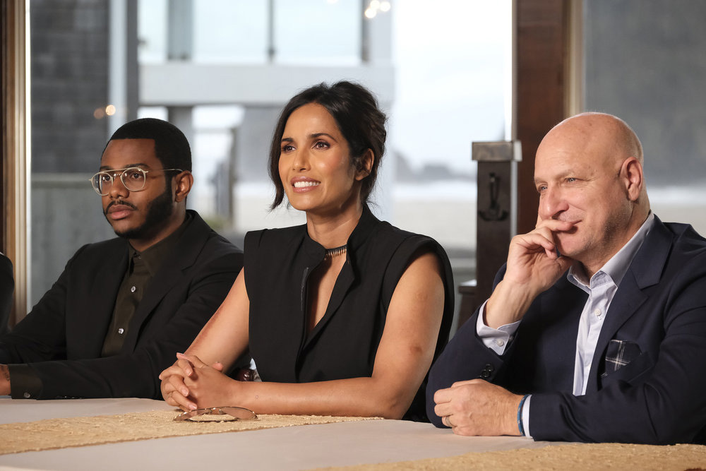 TOP CHEF -- "Shellfishly Delicious" Episode 1813 -- Pictured: (l-r) Kwame Onwuachi, Padma Lakshmi, Tom Colicchio -- (Photo by: David Moir/Bravo)