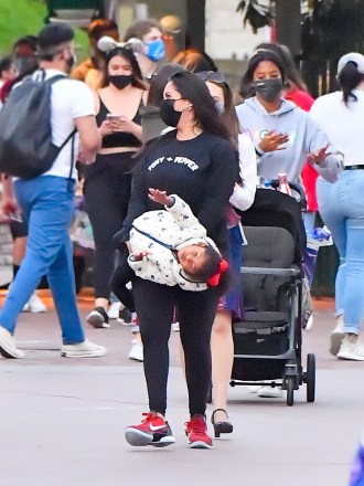 EXCLUSIVE: Vanessa Bryant and her three girls have a fun day touring the new Avenger's Campus at Disneyland. Vanessa was seen being playful with her youngest daughter swinging her as they were seen leaving the theme park in California. 03 Jun 2021 Pictured: Vanessa Bryant. Photo credit: Snorlax / MEGA TheMegaAgency.com +1 888 505 6342 (Mega Agency TagID: MEGA759897_001.jpg) [Photo via Mega Agency]