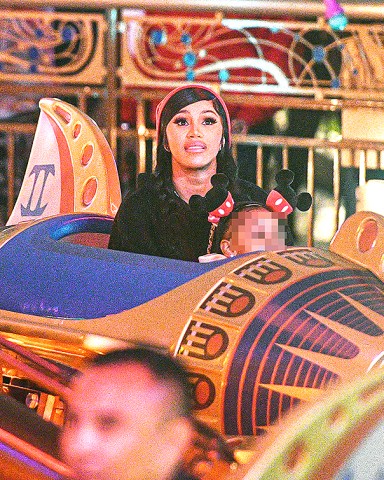 EXCLUSIVE: Cardi B Treated Her Daughter Kulture Kiari To A Magical Night At Disneyland In Anaheim, CA. The Mother & Daughter Duo Were Surrounded By Bodyguards As They Shopped & Enjoyed The Rides At The Happiest Place On Earth! The Two Were Seen Getting On 'It's Small World' In FantasyLand And Zipping Around On Astro Orbiters In Tomorrowland. **SPECIAL INSTRUCTIONS*** Please pixelate children's faces before publication.***. 27 Mar 2022 Pictured: Cardi B Treated Her Daughter Kulture Kiari To A Magical Night At Disneyland In Anaheim, CA. The Mother & Daughter Duo Were Surrounded By Bodyguards As They Shopped & Enjoyed The Rides At The Happiest Place On Earth! The Two Were Seen Getting On 'It's Small World' In FantasyLand And Zipping Around On Astro Orbiters In Tomorrowland. Photo credit: MEGA TheMegaAgency.com +1 888 505 6342 (Mega Agency TagID: MEGA842267_001.jpg) [Photo via Mega Agency]