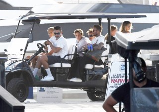 David Beckham & Victoria Beckham are seen leaving on a golf cart after a yacht trip with their kids Cruz, Romeo and Harper and friends David and Isabela Grutman in Miami Beach, Florida. 19 Apr 2022 Pictured: David Beckham; Victoria Beckham; Cruz Beckham; Romeo Beckham; Harper Beckham. Photo credit: MEGA TheMegaAgency.com +1 888 505 6342 (Mega Agency TagID: MEGA849669_001.jpg) [Photo via Mega Agency]