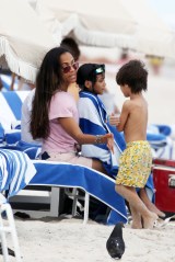 Zoe Saldana spends time with her kids at the beach in Miami **SPECIAL INSTRUCTIONS*** Please pixelate children's faces before publication.***. 09 May 2022 Pictured: Zoe Saldana. Photo credit: MEGA TheMegaAgency.com +1 888 505 6342 (Mega Agency TagID: MEGA855436_004.jpg) [Photo via Mega Agency]
