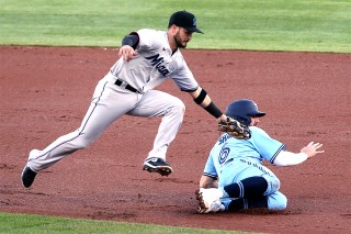 Toronto Blue Jays' Travis Shaw gets is tagged out by Miami Marlins second baseman Eddy Alvarez during the first inning of a baseball game, in Buffalo, N.Y
Marlins Blue Jays Baseball, Buffalo, United States - 12 Aug 2020
