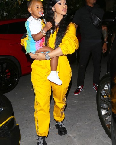 *EXCLUSIVE* Beverly Hills, CA  - Cardi B and daughter Kulture was seen in rare form as she attended Teyana Taylor’s exclusive listening party for her new album entitled “The Album”. Cardi looks chic as she sports the signature custom hazmat suit created for Teyana’s guest. Offset arrived later and the 3 enjoyed their time with Teyana’s daughter and others who attended the listening party. As seen in the picture, Offset embraces his daughter and smiles for the camera with Cardi B behind him.Pictured: Cardi BBACKGRID USA 17 JUNE 2020 BYLINE MUST READ: NYP/BLM / BACKGRIDUSA: +1 310 798 9111 / usasales@backgrid.comUK: +44 208 344 2007 / uksales@backgrid.com*UK Clients - Pictures Containing ChildrenPlease Pixelate Face Prior To Publication*