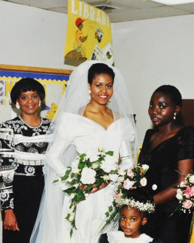 An intimate family wedding snap from the Obama wedding album. Bride Michelle Obama on her wedding day in Chicago. L to R:  Unknown, Maya Obama (Barack's sister) Michelle Obama, Auma Obama (Barack's sister) and unknown.
Various Barack Obama family images