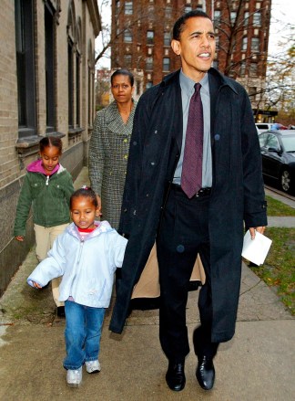 Michelle Obama, Barack Obama, Malia Obama, Sasha Obama Then-Illinois Democratic U.S. Senate candidate Barack Obama with his wife Michelle, daughters Sasha, front left, and Malia leaves the Catholic Theological union polling place in Chicago after voting. The leader who now lives in an executive mansion is fond of reminding people he is one of them: a parent who is not so far removed from economic struggles and family jugglesObama Making It Personal, CHICAGO, USA
