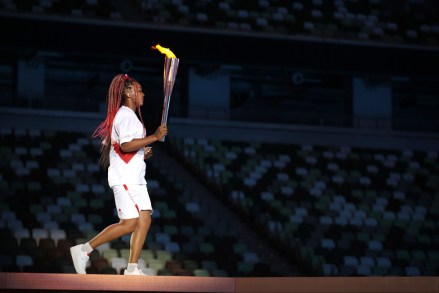 Naomi Osaka carries the Olympic Torch during the opening ceremony in the Olympic Stadium at the 2020 Summer Olympics, in Tokyo, Japan
Olympics Opening Ceremony, Tokyo, Japan - 23 Jul 2021
