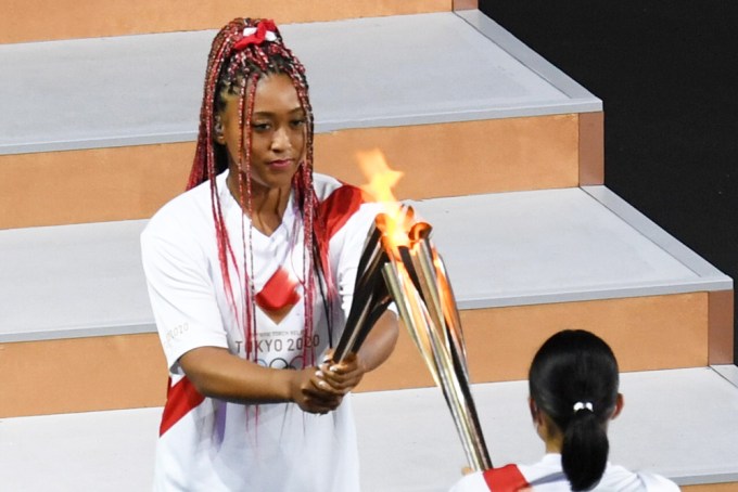 Naomi Osaka receives the flame