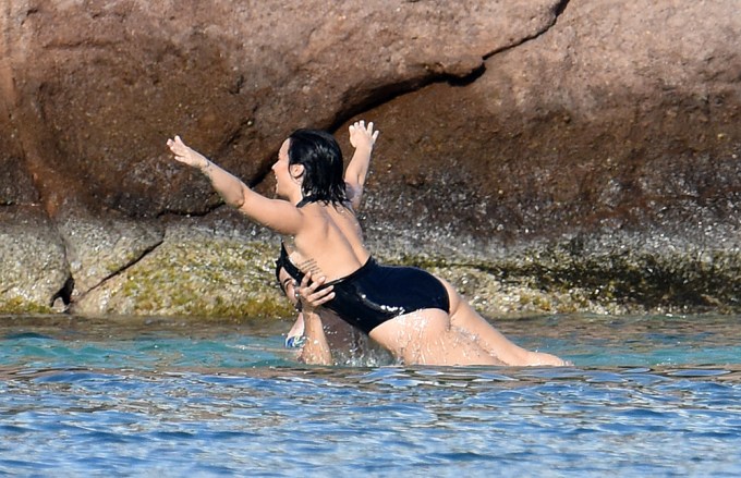 Demi Lovato and Wilmer Valderrama having fun in the water