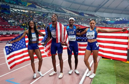 The United States team of Allyson Felix, Wilbert London, Michael Cherry and Courtney Okolo pose after winning the gold medal in the mixed 4x400 meter relay race at the World Athletics Championships in Doha, QatarAthletics Worlds, Doha, Qatar - 29 Sep 2019