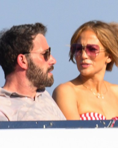 Jennifer Lopez and Ben Affleck enjoy Italy's famous Amalfi coast as J-Lo's 52 birthday celebrations continue. The on-again couple have been celebrating the occasion on a luxurious European jaunt with stops in St Tropez, France and Capri and Positano, Italy. During the trip, Ben, 48, surprised her with a very personal piece of jewelry that featured a medallion that represented feeling 'wild' and 'untamed'. J.Lo was also seen wearing a BEN necklace during her trip, but it is unclear if that was also a gift from him. Ben and Jennifer had been set to wed in 2003 but postponed their wedding before calling off their relationship. They rekindled their romance a few months ago after her split from Alex Rodriguez in April 2021 following four years of dating. A source said recently: 'They are having a beautiful trip. 'They celebrated Jen's birthday at a club. She looked gorgeous and very happy.' Jennifer is said to be 'fully committed' to Ben but doesn't want to jump into an engagement or marriage any time soon. 28 Jul 2021 Pictured: Jennifer Lopez and Ben Aflek for Lopez's 52 birthday on the Amalfi coast and Capri. Photo credit: MEGA TheMegaAgency.com +1 888 505 6342 (Mega Agency TagID: MEGA774719_025.jpg) [Photo via Mega Agency]