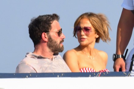 Jennifer Lopez and Ben Affleck enjoy Italy's famous Amalfi coast as J-Lo's 52 birthday celebrations continue. The on-again couple have been celebrating the occasion on a luxurious European jaunt with stops in St Tropez, France and Capri and Positano, Italy. During the trip, Ben, 48, surprised her with a very personal piece of jewelry that featured a medallion that represented feeling 'wild' and 'untamed'. J.Lo was also seen wearing a BEN necklace during her trip, but it is unclear if that was also a gift from him. Ben and Jennifer had been set to wed in 2003 but postponed their wedding before calling off their relationship. They rekindled their romance a few months ago after her split from Alex Rodriguez in April 2021 following four years of dating. A source said recently: 'They are having a beautiful trip. 'They celebrated Jen's birthday at a club. She looked gorgeous and very happy.' Jennifer is said to be 'fully committed' to Ben but doesn't want to jump into an engagement or marriage any time soon. 28 Jul 2021 Pictured: Jennifer Lopez and Ben Aflek for Lopez's 52 birthday on the Amalfi coast and Capri. Photo credit: MEGA TheMegaAgency.com +1 888 505 6342 (Mega Agency TagID: MEGA774719_025.jpg) [Photo via Mega Agency]