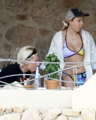 SARDINIA, ITALY  - *EXCLUSIVE*  - 'Stranger Things' British actress Millie Bobby Brown and boyfriend Jake Bongiovi enjoy their holiday together out in Sardinia. Millie was seen sporting a ring on her engagement finger.  Pictured: Millie Bobby Brown, Jake Bongiovi  BACKGRID USA 12 JULY 2022   BYLINE MUST READ: FREZZA LA FATA - COBRA TEAM / BACKGRID  USA: +1 310 798 9111 / usasales@backgrid.com  UK: +44 208 344 2007 / uksales@backgrid.com  *UK Clients - Pictures Containing Children Please Pixelate Face Prior To Publication*