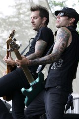 Tom Wisniewski and Mike Herrera of mxpx
2005 Warped Tour in Indianapolis
July 20, 2005 Indianapolis, IN.
Warped Tour.
Tom Wisniewski and Mike Herrera, of mxpx, performs during the 2005 Warped Tour at the Verizon Wireless Music Center near Indianapolis, Indiana.
Photo ® John D. Shearer / BEImages