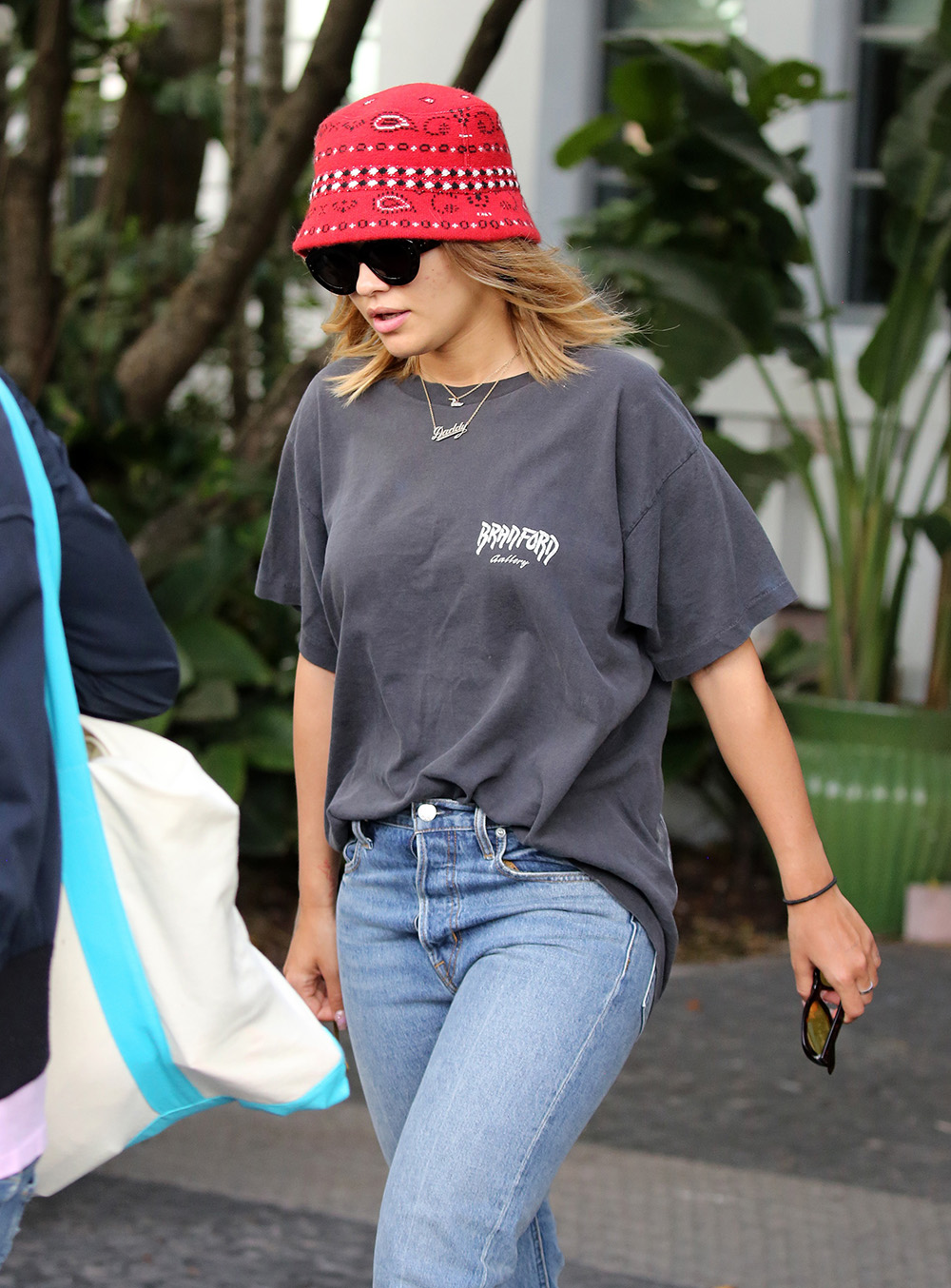 Rita Ora rocks a Louis Vuitton hoodie with black crop top and