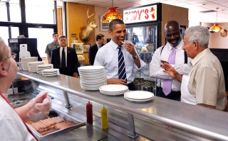 Barack Obama, Michael Bell, Harry Dionyssiou President Barack Obama eats a french fry as he makes an unannounced visit to Rudy's Hot Dog with Toledo Mayor Michael Bell, center, in Toledo, Ohio. Owner Harry Dionyssiou is at right
Obama, Toledo, USA