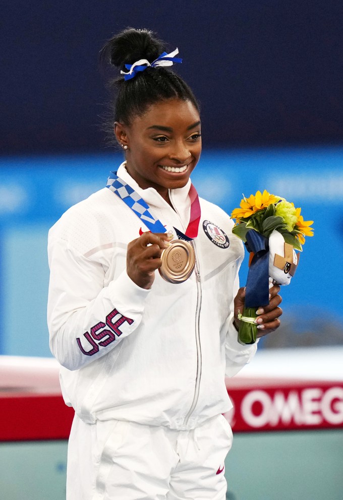 Simone Biles Showing Off A Bronze Medal