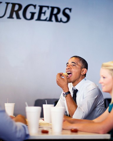Barack Obama, Emiy Young, Leslie Redmond, Maximo Soler President Barack Obama eats french fries as he visits with students at OMG! Burgers, in Miami, Fla. At right is Emily Young and right are Leslie Redmond and Maximo Soler
Obama 2012, Miami, USA
