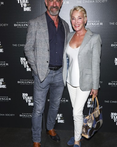 Actor Christopher Meloni, left, and his wife Sherman Williams, right, attend a special screening of "No Time to Die" hosted by Champagne Bollinger and The Cinema Society at iPic Theater, in New York NY Special Screening of "No Time to Die", New York, United States - 07 Oct 2021