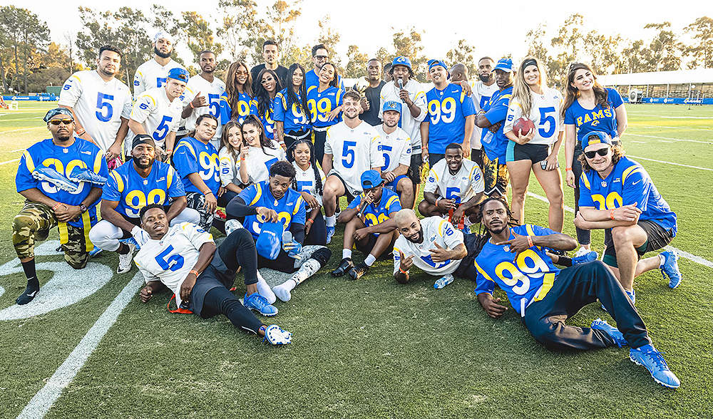 Rapper YG wears the jersey of Los Angeles Rams wide receiver