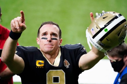 New Orleans Saints quarterback Drew Brees gestures to his family and fans after an NFL divisional round playoff football game against the Tampa Bay Buccaneers, in New Orleans. The Buccaneers won 30-20
Buccaneers Saints Football, New Orleans, United States - 17 Jan 2021