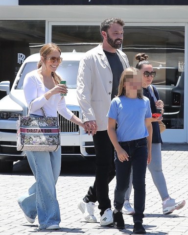 Beverly Hills, CA  - Jennifer Lopez and Ben Affleck look at the selection of high-end cars with Ben's son Samuel appearing to buy a new Rolls-Royce, at the Rolls-Royce Motor Cars dealer in Beverly Hills.  Pictured: Ben Affleck, Jennifer Lopez  BACKGRID USA 2 JULY 2022   BYLINE MUST READ: LaStarPixMEDIA / BACKGRID  USA: +1 310 798 9111 / usasales@backgrid.com  UK: +44 208 344 2007 / uksales@backgrid.com  *UK Clients - Pictures Containing Children Please Pixelate Face Prior To Publication*