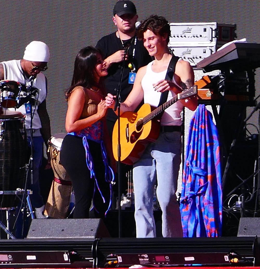 Camila Cabello and Shawn Mendes share multiple kisses as they laugh as stagehand keeps building the set during their romantic soundcheck as fans join in on the laughs as they perform at Global Citizens in the hot sun day before massive event in NYC