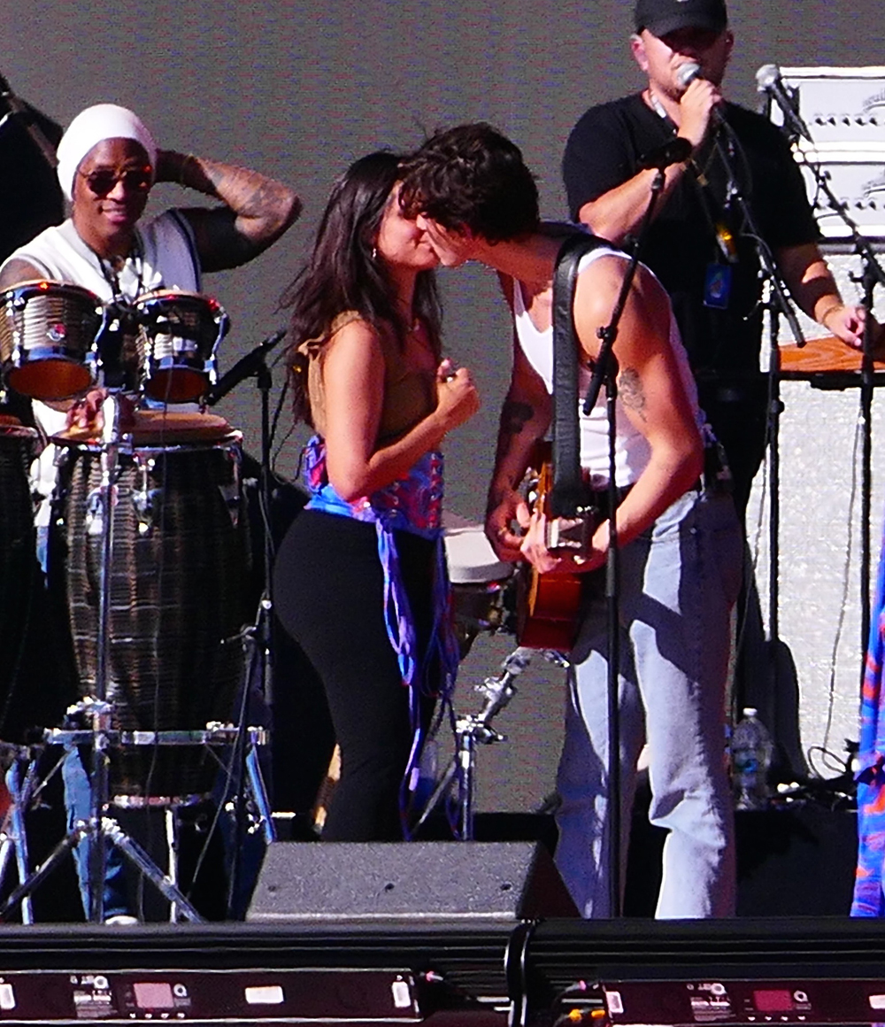 Camila Cabello and Shawn Mendes share multiple kisses as they laugh as stagehand keeps building the set during their romantic soundcheck as fans join in on the laughs as they perform at Global Citizens in the hot sun day before massive event in NYC