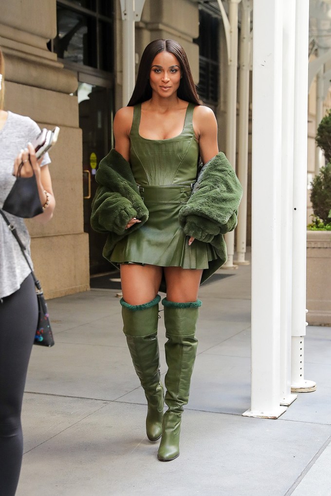 Ciara walking in green