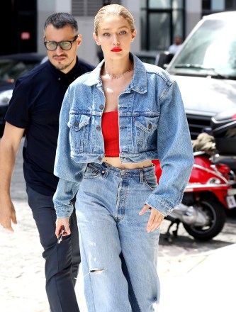 Gigi Hadid stepped out in New York City in an oversize denim jacket and baggy ripped jeans for her daily strut. 29 Jun 2017 Pictured: Gigi Hadid. Photo credit: MEGA TheMegaAgency.com +1 888 505 6342 (Mega Agency TagID: MEGA47646_016.jpg) [Photo via Mega Agency]