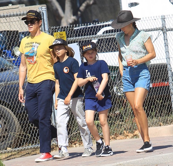 Johnny Knoxville and Naomi Nelson with their children on a family outing.