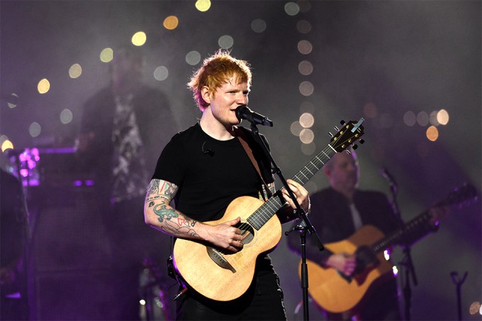 Ed Sheeran performs with his acoustic guitar