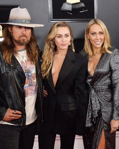 (L-R) Billy Ray Cyrus, Miley Cyrus and Tish Cyrus arrive for the 61st annual Grammy Awards held at Staples Center in Los Angeles on February 10, 2019.Grammy Awards 2019, Los Angeles, California, United States - 10 Feb 2019