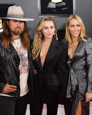 (L-R) Billy Ray Cyrus, Miley Cyrus and Tish Cyrus arrive for the 61st annual Grammy Awards held at Staples Center in Los Angeles on February 10, 2019.Grammy Awards 2019, Los Angeles, California, United States - 10 Feb 2019