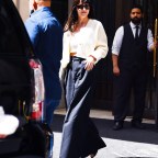 Dakota Johnson Leaves Her Hotel Wearing Bell Bottom Slacks In New York City