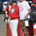 EXCLUSIVE: Gavin Rossdale puts his arm around his son Zuma after baseball practice
