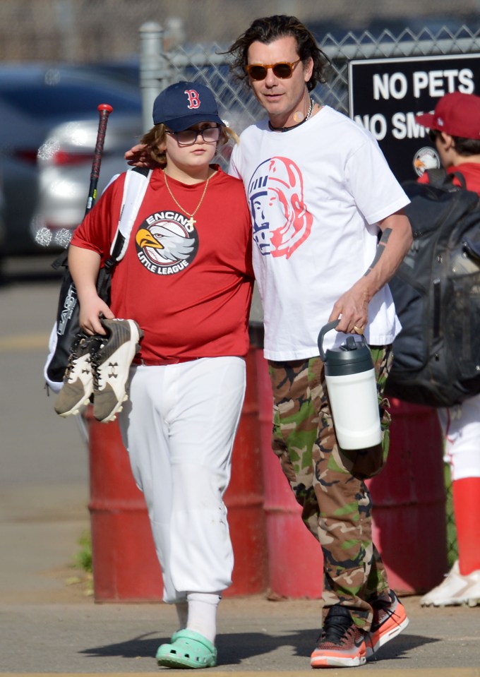 Gavin Rossdale puts his arm around his son Zuma after baseball practice
