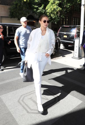 New York, NY  - *EXCLUSIVE*  - Gigi Hadid looks stylish in an all-white ensemble as she steps out during New York Fashion Week.Pictured: Gigi HadidBACKGRID USA 11 SEPTEMBER 2021 BYLINE MUST READ: GAMR / BACKGRIDUSA: +1 310 798 9111 / usasales@backgrid.comUK: +44 208 344 2007 / uksales@backgrid.com*UK Clients - Pictures Containing ChildrenPlease Pixelate Face Prior To Publication*