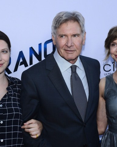 Cast member Harrison Ford attends the premiere of the motion picture thriller "Paranoia", with his daughter Georgia Ford (L) and wife, actress Calista Flockhart  (R) at the DGA Theatre in the Hollywood section of Los Angeles on August 8, 2013. The film depicts the story of the two most powerful high tech billionaires in the world, bitter rivals who will stop at nothing to destroy each other.
Paranoia Premiere, Los Angeles, California, United States - 09 Aug 2013