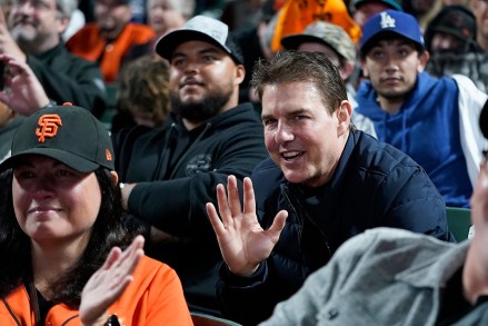 Actor Tom Cruise, middle right, waves during Game 2 of a baseball National League Division Series between the San Francisco Giants and the Los Angeles Dodgers, in San Francisco
NLDS Dodgers Giants Baseball, San Francisco, United States - 09 Oct 2021