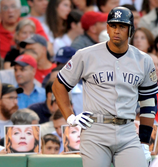 New York Yankees Third Baseman Alex Rodriguez Waits in the On Deck Circle As Fans Hold Photos of Madonna in the Second Inning Against the Boston Red Sox at Fenway Park in Boston Massachusetts Usa 25 July 2008Usa Baseball Mlb - Jul 2008